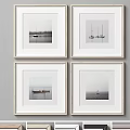 Four Minimalist White Picture Frames with Black and White Boat Photos Hanging on Wall