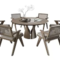 Modern Round Wooden Dining Table Set With Six Woven Chairs And Decorative Centerpiece