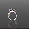 White Frog Head Shaped Decorative Ornament With Black Eyes On Dark Surface