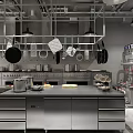 Commercial Kitchen Setup With Stainless Steel Workbench Hanging Cookware And Kitchen Appliances