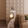 White Elephant Decorative Ornament Combination With Tabletop Light Next To Beige Sofa On Square Wall