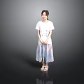 Woman in white T-shirt and colorful long skirt with sandals against gray background