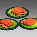 Three Plates of Fresh Pork Sausages on Green Leaves with Black Plates