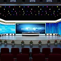 Modern Conference Stage Setup With Large Screens Colorful Lights And Red Seats