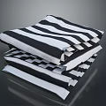 Stylish Black And White Striped And Checkered Bed Linens Stacked Neatly