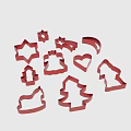 Red Cookie Cutters With Various Shapes Including Star Christmas Tree And Heart