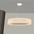 Modern Circular White Striped Pendant Light Hanging In Contemporary Interior