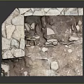 Ancient Stone Wall Corner with Stacked Stones and Scattered Debris on Ground
