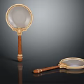 Vintage Magnifying Glasses With Wooden Handles And Golden Frames On Black Background