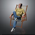 Man Sitting On Orange Folding Chair Wearing Yellow T Shirt Blue Jeans And White Shoes