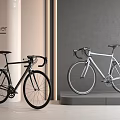 Black And White Designer Bicycles Showcased On Modern Stylish Display Platform
