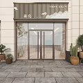 Elegant Storefront Facade Featuring Glass Double Doors Decorative Sign And Potted Plants On Stone Pavement