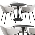 Modern Round Table With Four Beige Fabric Chairs And Black Metal Legs