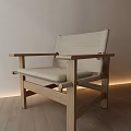 Minimalist Leisure Chair Featuring Wooden Frame Light Colored Cushion In Modern Room With Recessed Lighting
