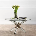 Glass Coffee Table With Crossed Metal Legs White Flower Vase And Books On Wooden Floor