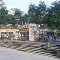 Urban Outdoor Plaza Featuring Steps Plants Kiosk Green Trees And Buildings