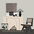 Modern White Fireplace With Artwork Wood Logs Black Lamp And Woven Chair