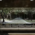 Modern Garden Landscape With Illuminated Geometric Patterns Trees Grass And Paved Pathways