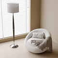 Round White Single Sofa With Pillow And Blanket Near Floor Lamp And Window Blinds
