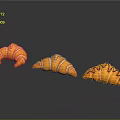 Sculpture Carving Of Three Orange Croissants With Striped Surface Design Details