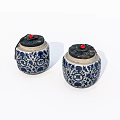 Traditional Ceramic Jars With Blue And White Floral Pattern And Red Knob Lids