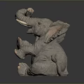 Cute Elephant Sculpture In Sitting Pose With Raised Trunk Large Ears And White Tusks