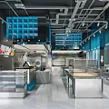 Modern Dessert Shop Interior With Open Layout Stainless Steel Counters And Blue Accents