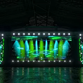 Vibrant Stage With PULSE LED Screens Green Lights And Audience Glow Sticks