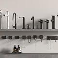 Various Modern Black And White Water Faucets Displayed On Shelves With Different Styles