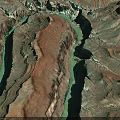 Aerial View Of Rocky Terrain With Winding Turquoise River And Colorful Canyon Landscape