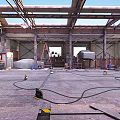 Industrial Parking Lot With Brick Walls Metal Stairs Barrels And Wooden Planks
