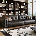 Black Leather Three Seater Sofa With Decorative Pillows Bookshelf And Patterned Rug In Living Room