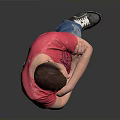 Young Man In Red T-Shirt And Blue Jeans Standing With Arms Crossed On Gray Background