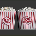 Delicious Freshly Popped Popcorn in Red and White Striped Paper Buckets on Black Surface