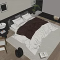 Cozy Double Bed With Soft Brown White Bedding Pillows On Wooden Floor Rug And Armchair