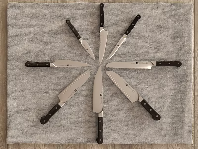 Set of Kitchen Knives Arranged in Star Shape on Gray Towel with Sharp Blades 3d model