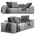 Stylish Two Seater Sofa With Decorative Pillows And Cozy Blanket In Modern Living Room Interior