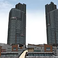 Urban Commercial Complex Featuring Tall Glass Buildings Low Rise Structures Plaza Greenery And Walkways