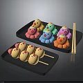 Colorful Cartoon Shaped and Brown Round Food Skewers on Black Trays