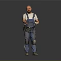 Man in Blue Overalls and White T-Shirt with Knee Pads holding Tools against Gray Background