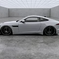 White Jaguar Sports Car With Modern Sleek Exterior In Gray Indoor Space