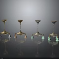 Elegant Decorative Candle Holders With Four Stylish Metal Bases And Colored Tassel Accents