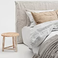 Cozy Minimalist Bedroom Bed With Beige Headboard Pillows Gray Blanket And Wooden Stools