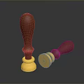 Two Household Seal Stamps with Wooden Handles Gold Bases Standing Upright and Lying