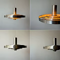 Modern Metallic Pendant Light With Layered Circular Structure And Warm Yellow Glow 3d model