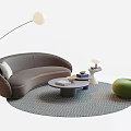 Curved Gray Sofa Round Coffee Table Set with Green Accent Chair Floor Lamp Geometric Rug