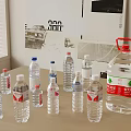 Various Sizes of Bottled Drinking Water with Plastic Bottles and Large Container