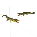 Two Green Plastic Crocodile Toys With Open Mouths On White Background