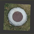 Red Manhole Cover On Green Grass With Concrete Border And Scattered Fallen Leaves