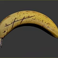 Ripe Yellow Banana With Natural Brown Spots On Dark Reflective Surface